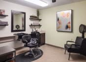 Thumbnail 21 of 35 - salon with chair and art on the wall