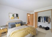 Thumbnail 12 of 35 - bedroom with bed and nightstand and a wide closet