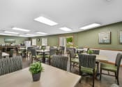 Thumbnail 27 of 35 - a large dining room with tables and chairs and chairs