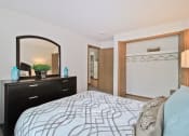 Thumbnail 14 of 35 - bedroom with dresser and mirror and  closet