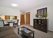 Thumbnail 11 of 35 - a living room with a couch and a table    and a dining room