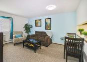 Thumbnail 9 of 35 - a living room with a couch and a table