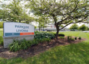 Thumbnail 35 of 35 - a sign for parkside livonia in front of a tree
