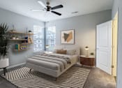 Thumbnail 5 of 21 - A bedroom with a bed, a ceiling fan, and a rug.