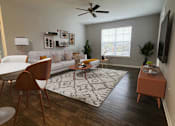Thumbnail 3 of 21 - A living room with a brown chair and a white couch.