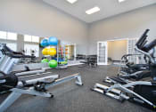 Thumbnail 10 of 21 - a gym with weights and other exercise equipment and balloons