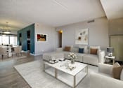 Thumbnail 3 of 44 - A modern living room with a glass coffee table and white couches.