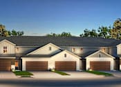 Thumbnail 42 of 44 - A large, two-story house with a garage on each floor.