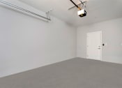 Thumbnail 18 of 26 - an empty room with a door and a ceiling fan