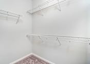 Thumbnail 16 of 26 - our spacious closets are equipped with shelves and hooks for hanging clothes