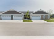 Thumbnail 30 of 31 - front view of a house with two garage doors
