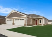 Thumbnail 1 of 31 - a house with a driveway and lawn in front of it