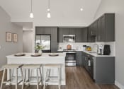 Thumbnail 2 of 31 - a kitchen with a large island with stools