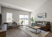 Thumbnail 7 of 31 - a living room with a couch and a coffee table and a sliding glass door