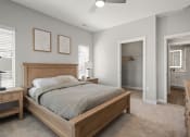 Thumbnail 11 of 31 - a bedroom with a bed and a closet