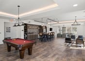 Thumbnail 20 of 31 - a community room with a pool table and a bar
