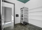 Thumbnail 21 of 53 - A kitchen with a refrigerator and empty shelves.