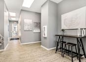 Thumbnail 47 of 53 - A room with a wooden floor and a large painting on the wall.