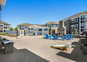 Thumbnail 53 of 53 - A sunny day at the outdoor pool area of a residential complex.