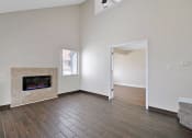 Thumbnail 17 of 32 - the living room has a fireplace and hardwood floors