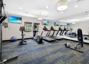 Thumbnail 25 of 32 - our state of the art gym includes cardio machines and weights