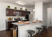 Thumbnail 3 of 25 - turtle creek apartments kitchen with island
