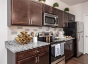 Thumbnail 4 of 25 - turtle creek apartments kitchen