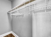 Thumbnail 19 of 44 - Empty white shelves on a wall.