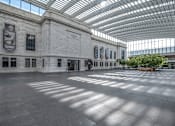 Thumbnail 43 of 44 - The interior of a museum with a glass roof and walls.