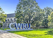 Thumbnail 38 of 44 - A large CWRU sign is in front of a building.