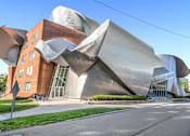 Thumbnail 30 of 44 - A modern building with a unique design is shown.