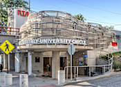 Thumbnail 20 of 44 - A building with a sign that says Italy University Circle.