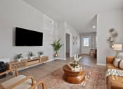 Thumbnail 5 of 24 - a living room with a couch and a tv