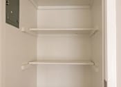 Thumbnail 12 of 15 - Empty white shelves in a pantry.