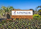 Thumbnail 30 of 30 - a sign for the vinings at carolina blvd in front of plants