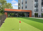 Thumbnail 45 of 82 - a putting green in front of a building