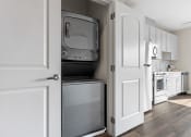 Thumbnail 24 of 82 - a kitchen with a refrigerator freezer and a stove top oven
