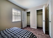Thumbnail 10 of 24 - A bedroom with a bed and a window.