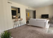 Thumbnail 1 of 19 - a living room with a couch and a television