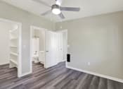 Thumbnail 27 of 29 - A room with a ceiling fan and a grey floor.