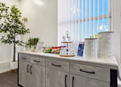 Thumbnail 11 of 27 - Refreshment station with bottled water and snacks at ELEVATE Apartments HOMES, Placentia, California