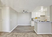 Thumbnail 15 of 27 - Open concept kitchen with breakfast bar at ELEVATE Apartments HOMES, Placentia, CA 92870