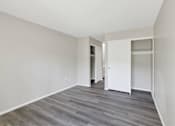 Thumbnail 19 of 20 - A room with a grey floor and white walls at THE STREAMS Apartments, Apartments, Fullerton, CA
