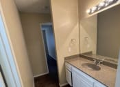 Thumbnail 17 of 28 - Vanity-sink-and-hallway at ELEVATE, Placentia, CA