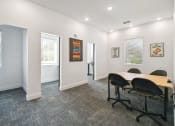 Thumbnail 4 of 25 - a conference room with a table and chairs in front of a window at Gibson Oaks, Lakeland, 33809