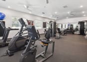 Thumbnail 7 of 25 - the gym is equipped with cardio equipment and weights at Gibson Oaks, Lakeland, 33809