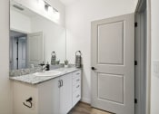 Thumbnail 16 of 25 - a bathroom with a sink and a mirror at Gibson Oaks, Lakeland, 33809