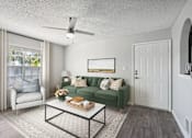 Thumbnail 8 of 32 - A living room with a green couch and a white chair.