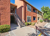 Thumbnail 32 of 32 - A red brick building with a staircase leading to the entrance.