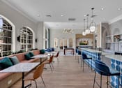 Thumbnail 45 of 57 - Clubhouse with tables and chairs and a bar